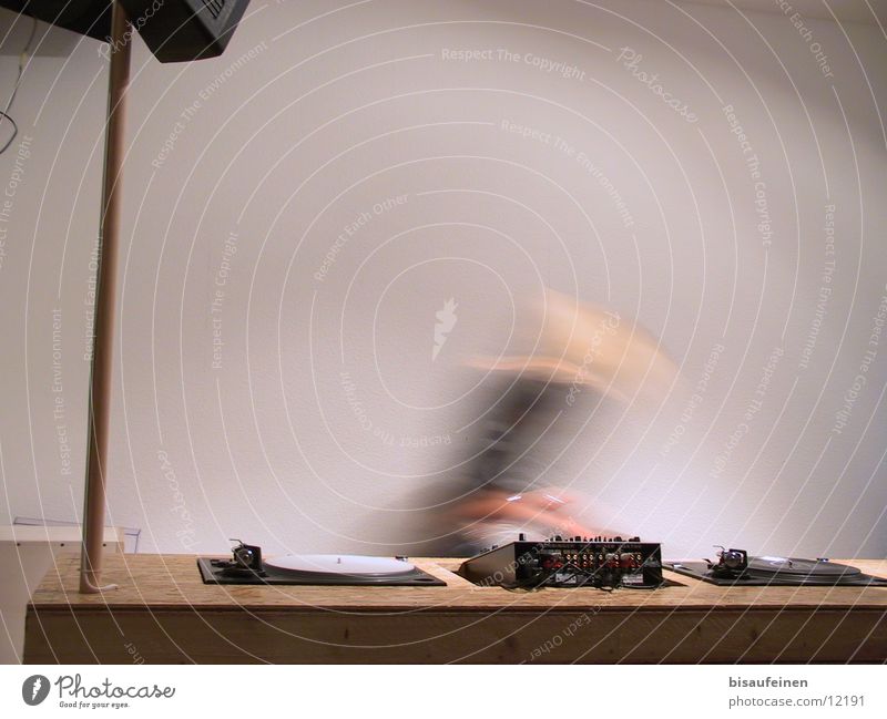 Webradio Disc jockey Workplace Radio (broadcasting) Movement Mixing desk Record player Dynamics Music Colour photo Interior shot Copy Space top Motion blur