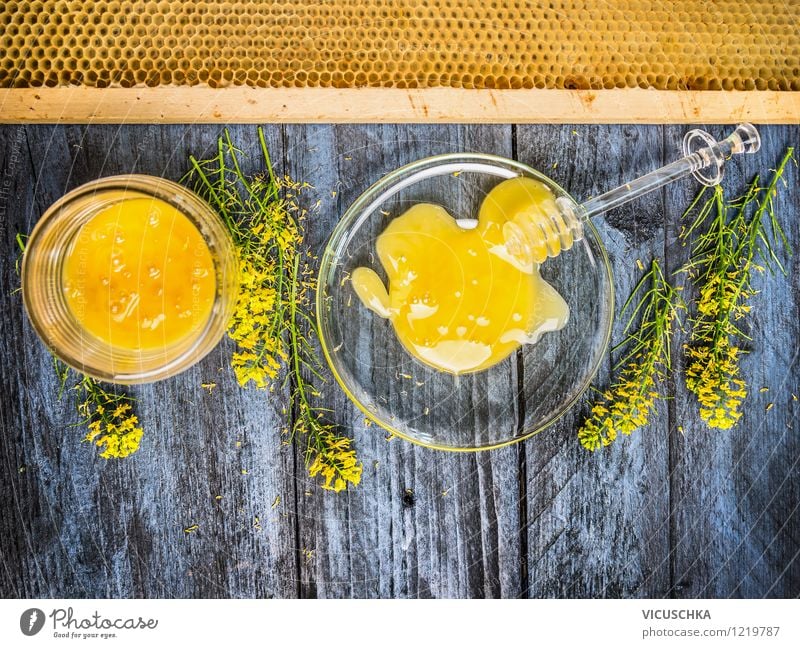 Rapeseed honey with fresh flowering plant and honeycomb Food Dessert Candy Nutrition Organic produce Vegetarian diet Diet Plate Bowl Glass Spoon Style Design