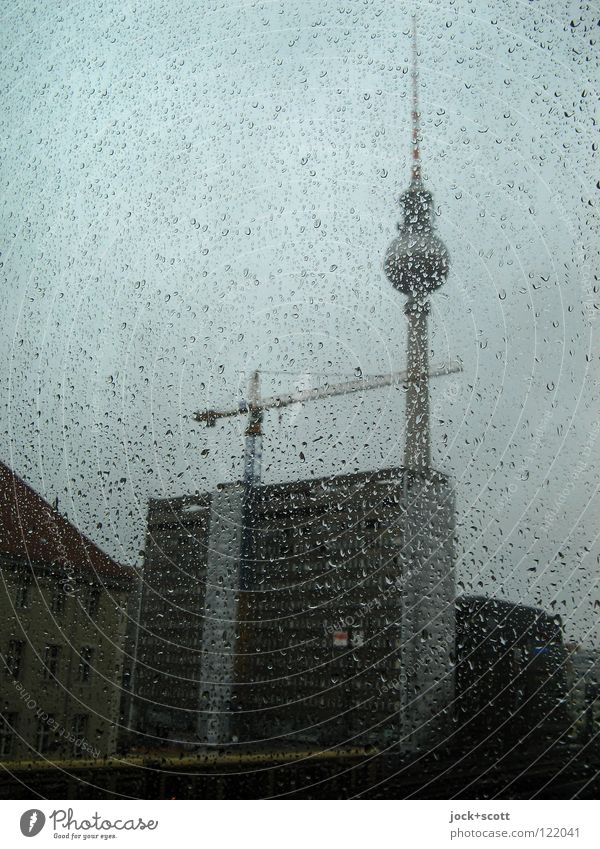 Perl Edition / Panorama Drops of water Bad weather Rain Downtown Berlin Capital city Alexanderplatz Berlin TV Tower Dreary Window pane Subdued colour Twilight