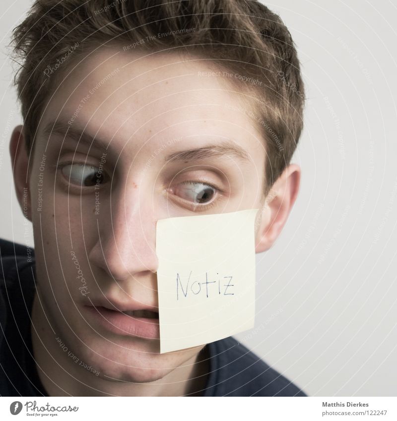 oblivious Youth (Young adults) Surprise Amazed Squint Piece of paper Write Forget Portrait photograph Adhesive Letters (alphabet) Word Typography Notebook