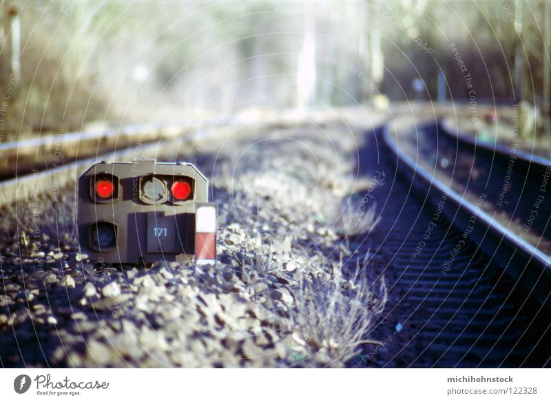 the train is coming... Railroad tracks Traffic infrastructure Slide Analog Gravel Red Traffic light Engine driver Transport Signal Switch depth blur