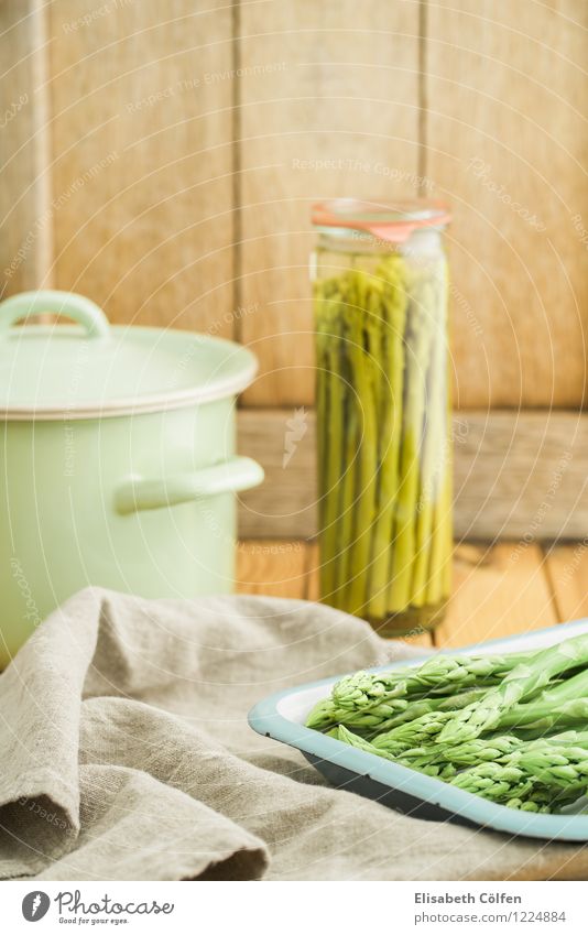 Pour in green asparagus Vegetable Plate Pot Wood Fresh Green Preserving jar Conserve Canned Asparagus Ingredients Cooking Eating Wooden table Food photograph