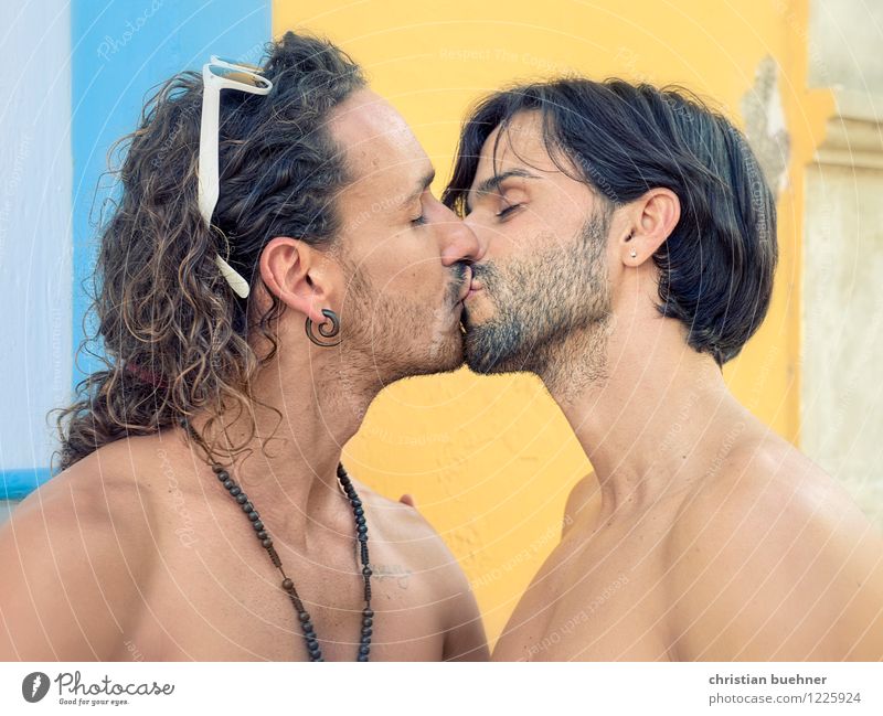 older gay men kiss each other
