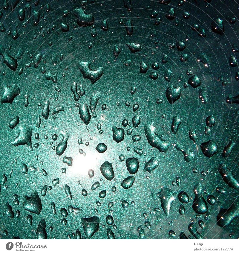 Raindrops in sunlight on dark green paint Wet Storm Car paint Stick Green Dark green Sun Reflection Glittering Multiple Small Structures and shapes Together