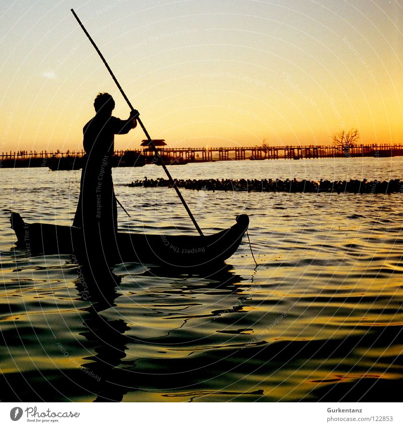 Burmese fisherman Myanmar Fisherman Watercraft Lake Sunset Dusk Asia Stick Navigation Bridge Motor barge Gold Shadow Silhouette