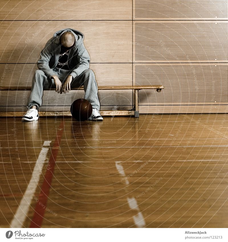 devastated School sport Gymnasium Basketball basket Parquet floor Man Basketball player Think Disappointment Boredom Substitute Loneliness Lose Doomed Completed