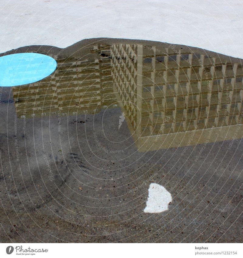 soil art Water Town House (Residential Structure) High-rise Floor covering Concrete Blue Brown Gray Architecture Puddle Circle Mirror image Asphalt Colour photo