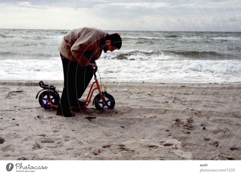 heavy trip Scooter Beach Man Ocean Large Small Slowly Heavy Baltic Sea