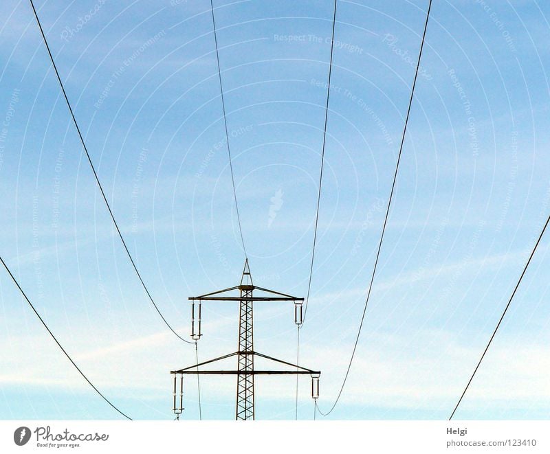 Power pole with power lines stands in front of blue sky with clouds Electricity pylon Wire Large Might Geometry Steel Towering Dangerous Transmission lines