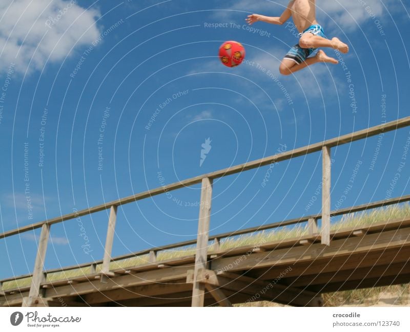 angel football Sylt Beach Footbridge Pants Shoot Playing Jump Air Hover Headless Clouds Worm's-eye view Red Joy Funsport Ball To fall Movement Sand Arm Feet