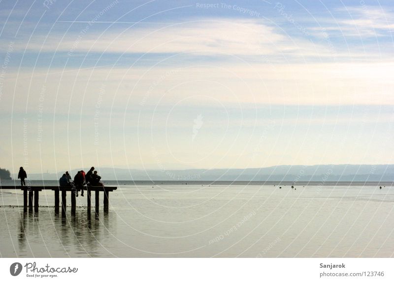 Freedom! February Lake Spontaneous Friendship Jetty Footbridge Leisure and hobbies Buoy Summer Winter Clouds Horizon Lake Ammer Bavaria Joy Group Sky