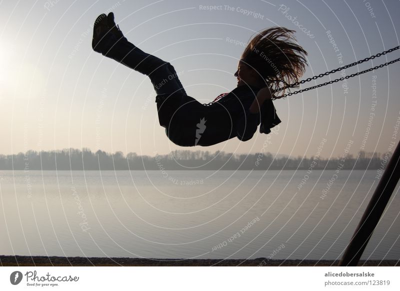 How beautiful it is to be a child. Swing Lake Playground Silhouette Joy Flying Hair and hairstyles Wind Shadow To hold on Laughter Snapshot