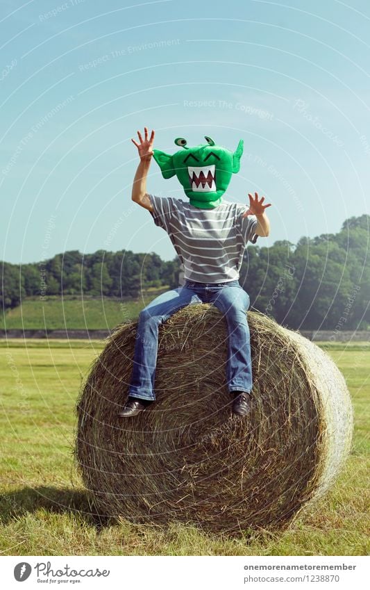 Grrrrrrrrrrrr Art Esthetic Monster Monstrous Ogre Extraterrestrial being Bale of straw Hay bale Landscape Blue sky Green Mask Disguised Costume Carnival costume