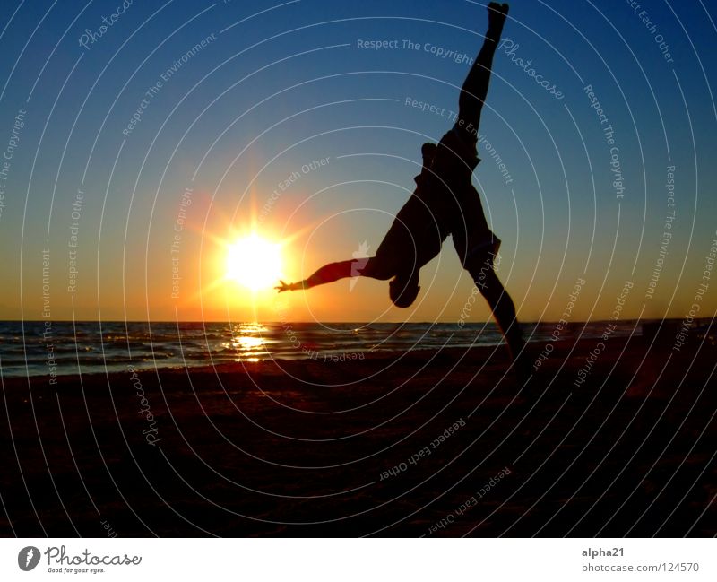 Reaching for the sun Sunset Beach Trick Vacation & Travel Ocean arcobatik Sports
