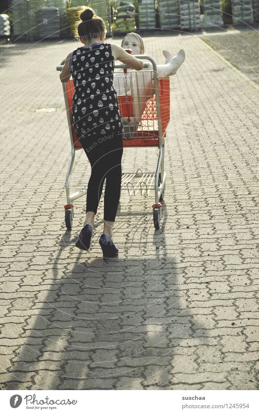 go shopping ..... Child Girl Young lady Youth (Young adults) Young woman Shopping Push Running Shopping Trolley Mannequin High heels Infancy Whimsical Strange