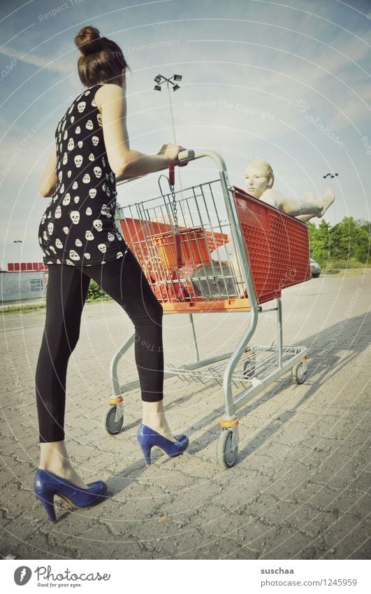 go shopping .... Child Girl Young lady Youth (Young adults) Young woman Shopping Push Running Shopping Trolley Mannequin High heels Infancy Whimsical Strange