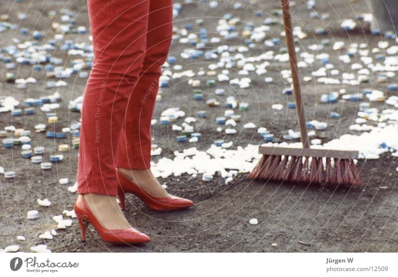 Woman in Red Broom Footwear Pants Trash Human being Legs shoes trousers garbage waste