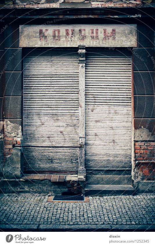 Spreedorado | Consumption Deserted House (Residential Structure) Building Store premises Facade Window Shop window Roller shutter Roller blind Company sign Old