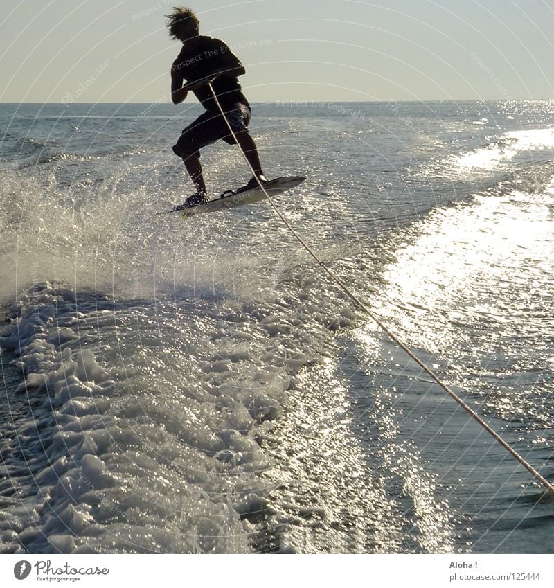 have you been dragged along? Summer Waves Ocean Watercraft White Black Suit Foam Splash of water Wet Leisure and hobbies Sports Swell Driving Speed Jump Wetsuit
