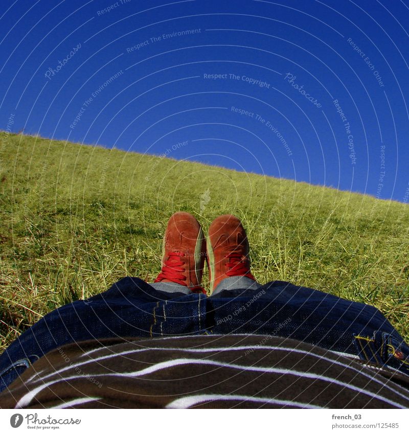 Fault-in-the-Sun-Lay Perspective Sky Cyan Brilliant Footwear Pants Grass Meadow T-shirt Red White Stripe Striped Lie Relaxation To enjoy Green Juicy Spring