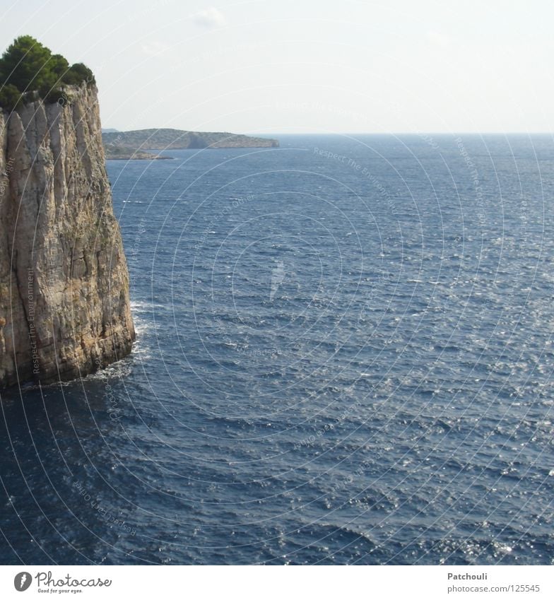 The cliffs of Kornati Croatia National Park String of islands Cliff Steep Ocean Horizon Waves Beach Coast Stone Minerals Island Rock Tall Blue Line