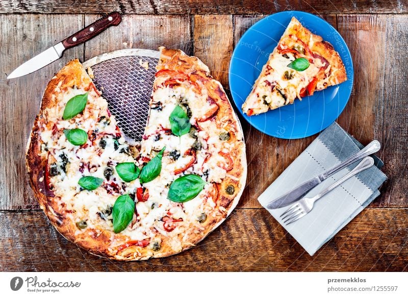 Fresh homemade pizza on wooden table Food Vegetable Lunch Dinner Fast food Italian Food Plate Knives Fork Table Wood cuisine Home Home-made Horizontal knife