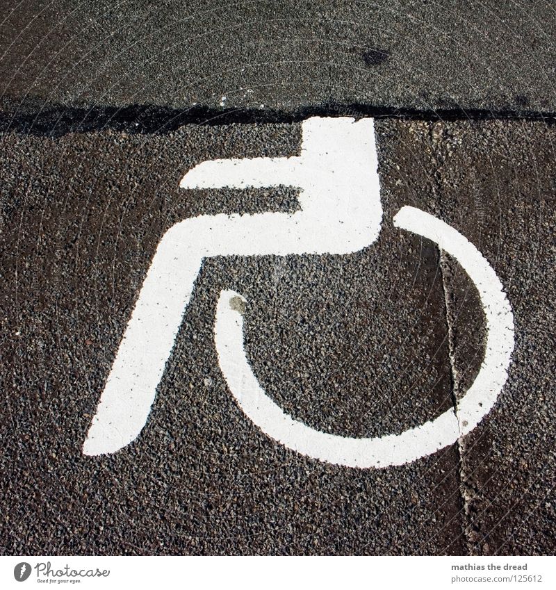 headless Asphalt Concrete Hard Cold Black Tar Stripe White Ground markings Wheelchair Handicapped Headless Incomplete Traffic infrastructure Healthy Signage