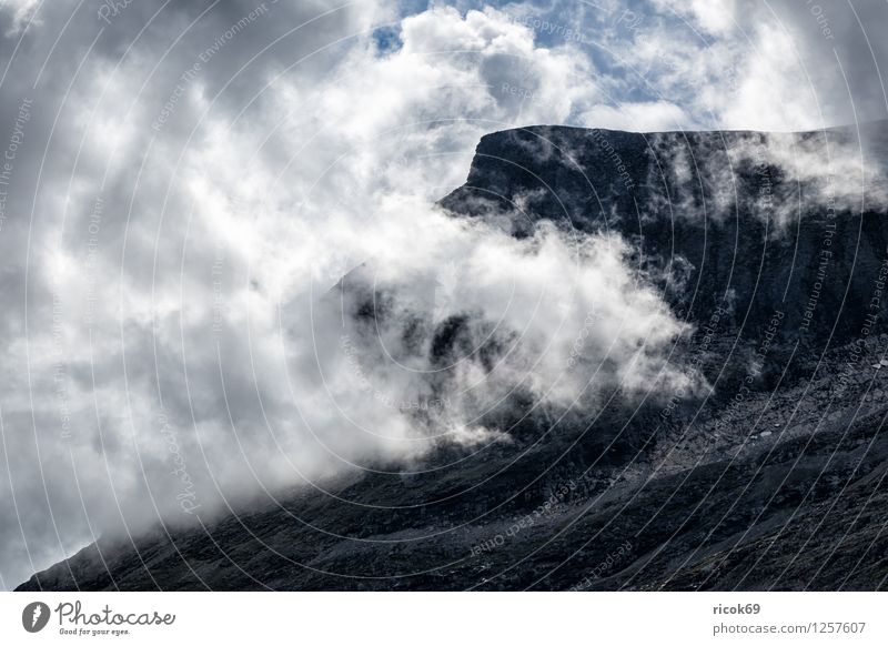 Mountain with clouds Relaxation Vacation & Travel Sun Nature Landscape Clouds Idyll Tourism Norway Møre og Romsdal destination Sky voyage Scandinavia