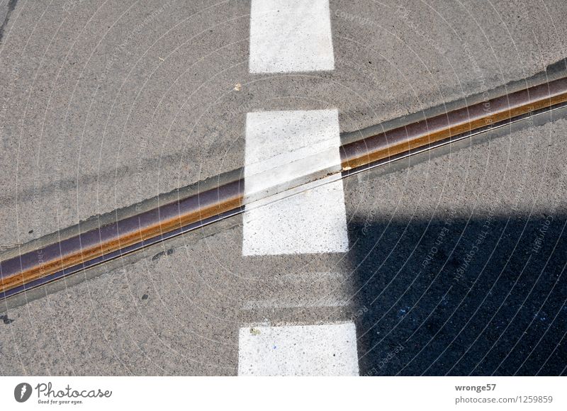 Halberstädter Street Traffic infrastructure Road junction Railroad tracks Signs and labeling Line Stripe Town Brown Gray Black White Pavement Marker line Lined