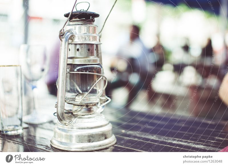 light source Decoration Lamp Old Historic Oil lamp gas lamp Beer garden Table Garden Colour photo Close-up Copy Space right Copy Space bottom Day
