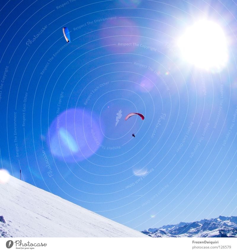 paraglider 4 Parachute Flying sports Reflection Paragliding Red Sunbeam Radiation Federal State of Tyrol White Westendorf Winter Austria Nature Sky Snow