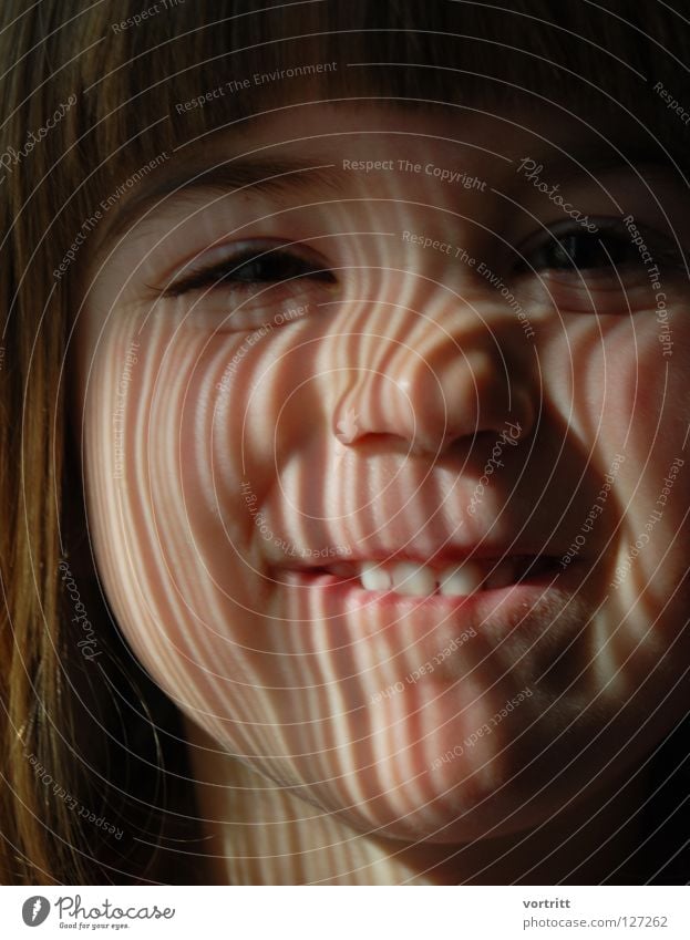 EAN II.III.I.IIII.II Child Close-up Portrait photograph Light Shaft of light Drape Dark Earnest Denote Stripe Barcode Science & Research Face Eyes Mouth Nose