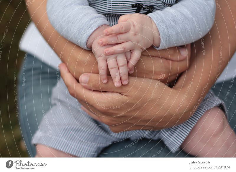 Baby reaching for feet, dimpled baby hands, triangle print blanket