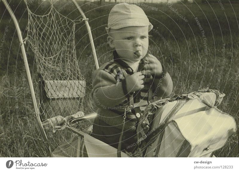 50ies - CHECKER Sixties Historic Black & white photo Toddler Exterior shot Baby carriage Eating Sunhat 1 - 3 years Appetite Portrait photograph Childhood memory
