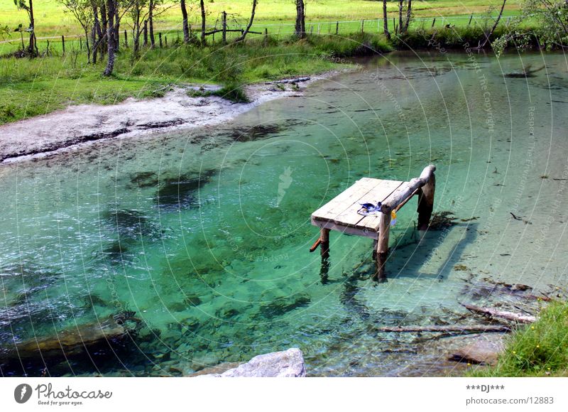 water lounger Lake Green Grass Wood Relaxation Vacation & Travel River Bench Water Mountain Stone Lie