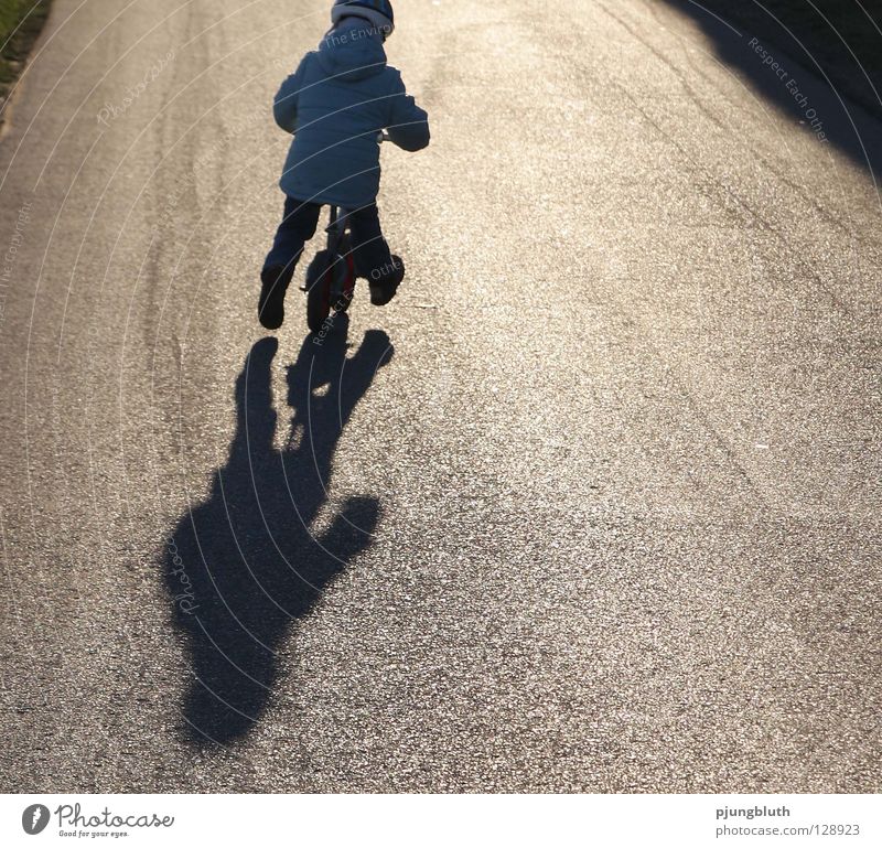 from home Child Light Asphalt February Back-light Contentment Practice Playing Sunday Toddler To go for a walk Shadow Street Study Kiddy bike