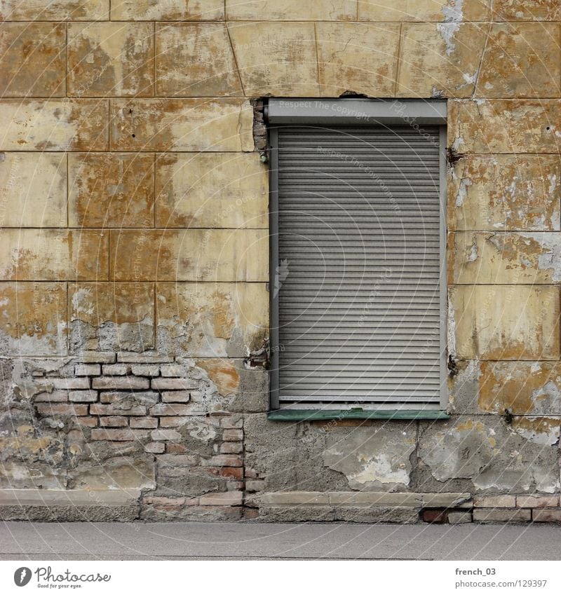 Do you still live? House (Residential Structure) Wall (building) Wall (barrier) Window Roller shutter Yellow Broken Decompose Brick Archaic Building Beige