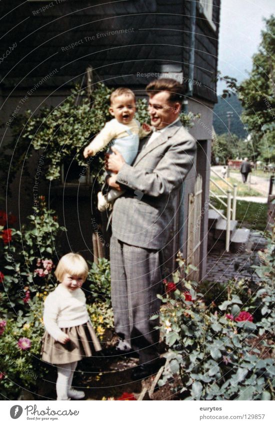 the father Father Child Family & Relations Sunday Happiness Flower Safety (feeling of) Suit Hair and hairstyles Old-school Sixties Seventies Siegerland Rose