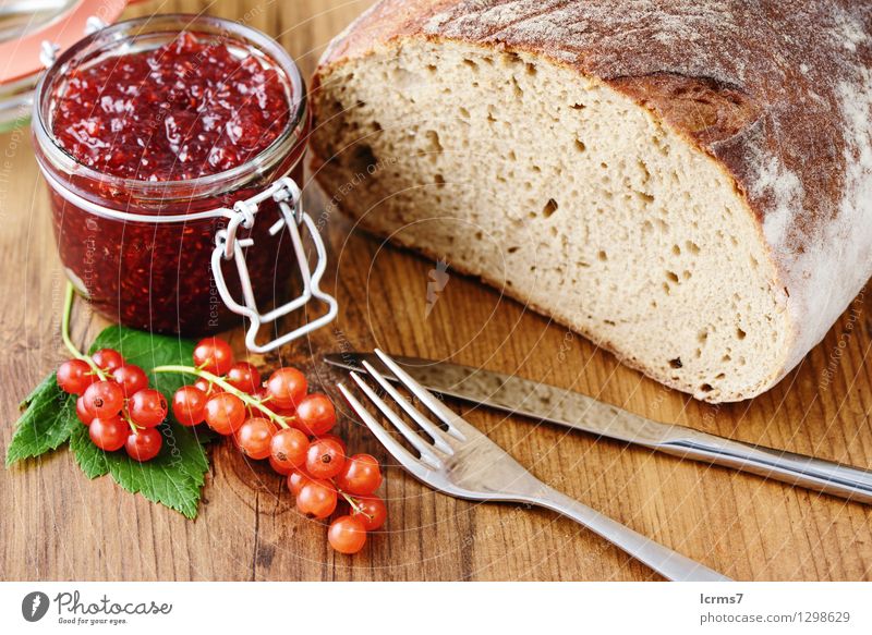red currant jam and fresh bread Fruit Bread Jam Nutrition Breakfast Cutlery Knives Fork Eating currants bowl blue white table wood ribes rubrum food background
