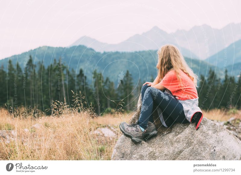Girl is thougthful in the mountains Vacation & Travel Trip Summer Mountain Hiking Child 1 Human being 8 - 13 years Infancy Nature Landscape Grass Forest Rock
