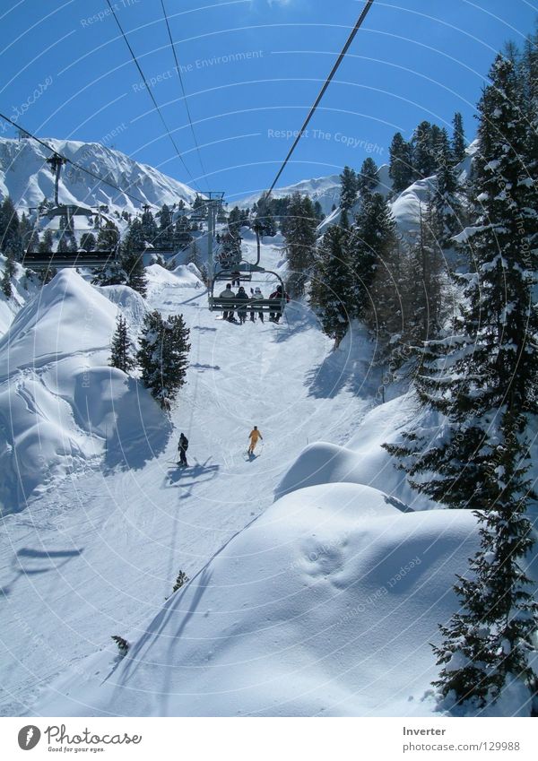 in the chairlift Vacation & Travel France White Human being Chair lift Cable car Mont Blanc Winter Snow Tall Weather Skiing Fir tree Ski lift Ski resort Ski run