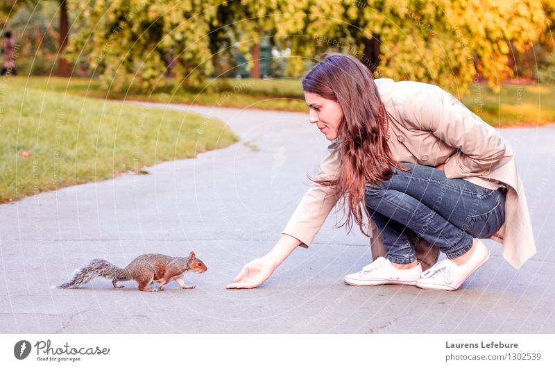 Girl and squirrel Feminine Young woman Youth (Young adults) 1 Human being 18 - 30 years Adults Garden Wild animal Animal Baby animal Eating To feed Feeding