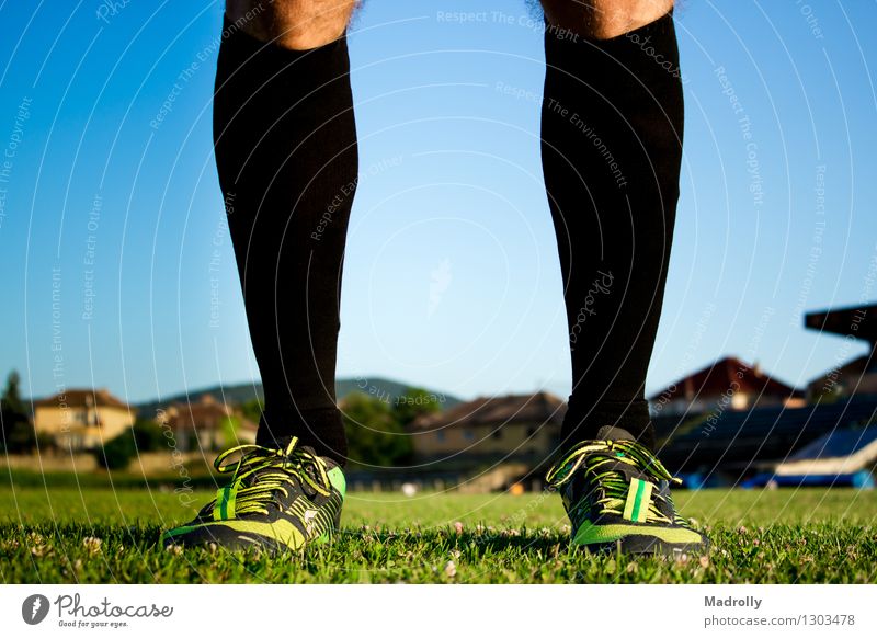 Soccer player posing Leisure and hobbies Garden Chair Sports Success Stadium Human being Man Adults Feet Nature Sky Grass Sphere Stand Green Perspective Action