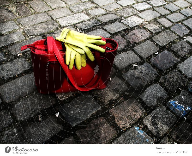 turned off Bag Gloves Red Green Leather Places Stand Posture Things Clothing Traffic infrastructure cobblestone pavement Street Lie Wait Leather bag