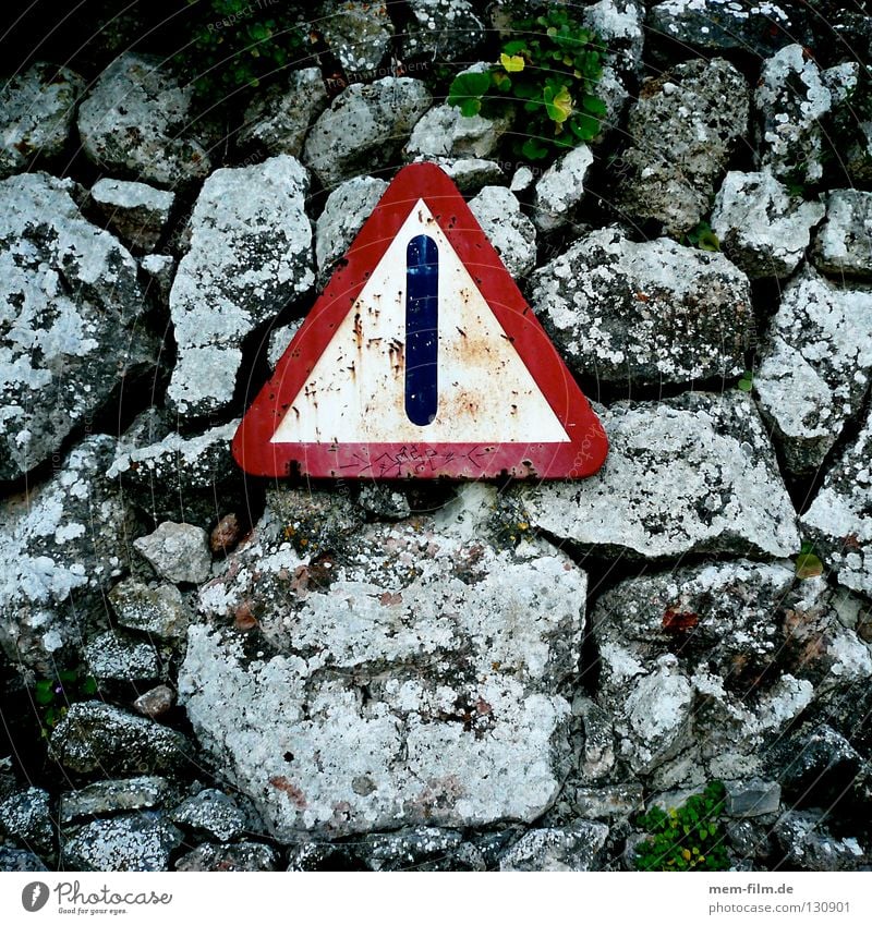 I'd be careful. Street sign Wall (barrier) Red Transport Caution Signs and labeling Rockfall Stone Old Rust
