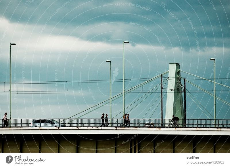 river crossing Pedestrian Work and employment Cologne Lantern Clouds Aspire Suspension bridge Bridge Human being Car Rhine Thunder and lightning Escape River