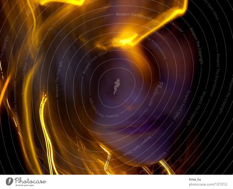 electric annealing wormsIII Physics Glow Light Visual spectacle Fairy lights Dark Planning Yellow Black Long exposure Smear Woman Warmth Lamp glowing Face