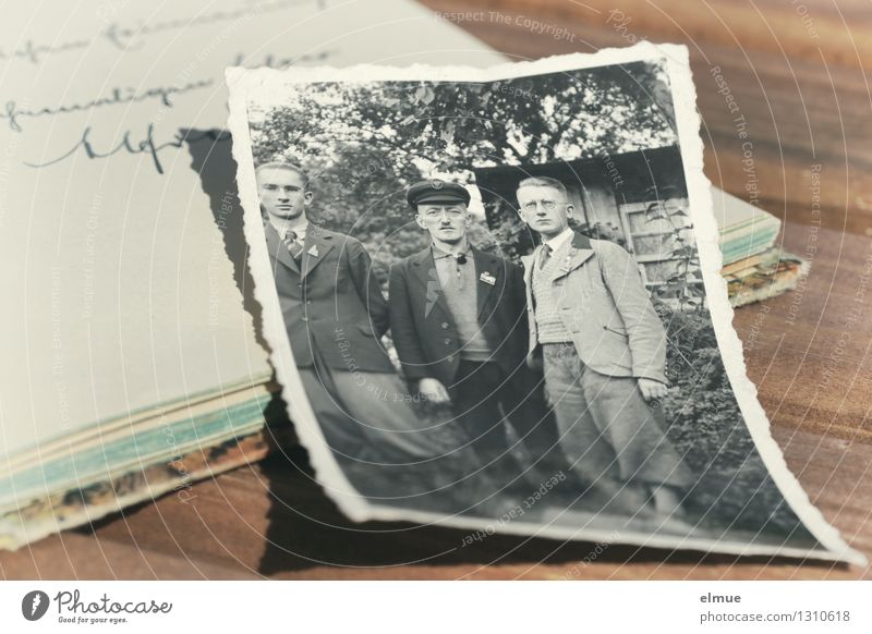 old paper picture lies on an old diary Friendship book Photography Document Novel Novella Past Old Authentic Historic Uniqueness Emotions Romance Sadness