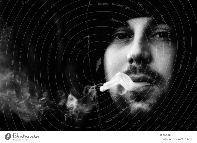 the melancholic smoker Lifestyle Smoking Contentment Calm Masculine Man Adults 1 Human being 18 - 30 years Youth (Young adults) Cap Designer stubble Beard Smoke