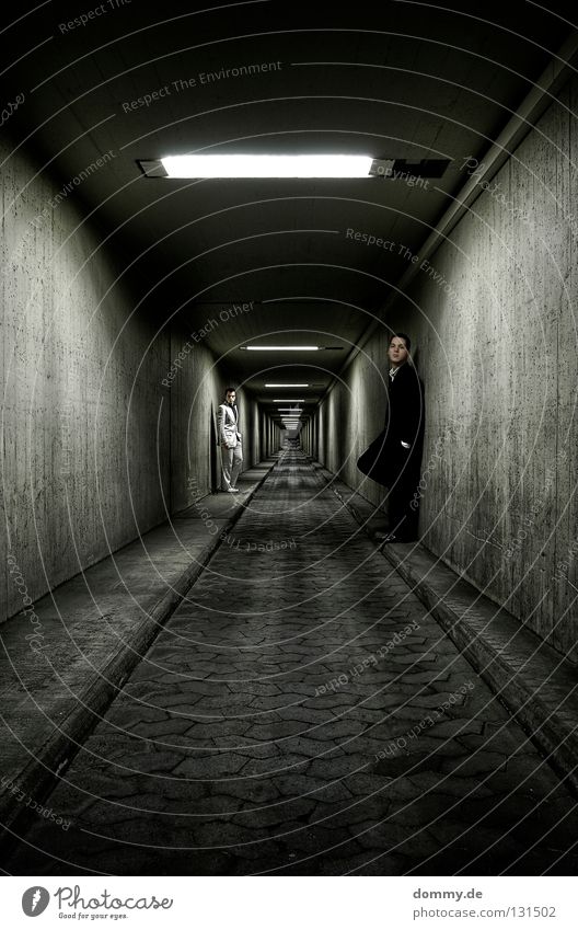 Endless Man Fellow Stand Tunnel Wall (building) Suit Infinity Light Curbside Sidewalk Night Dark White Black Subsoil Posture Long exposure Fluorescent Lights
